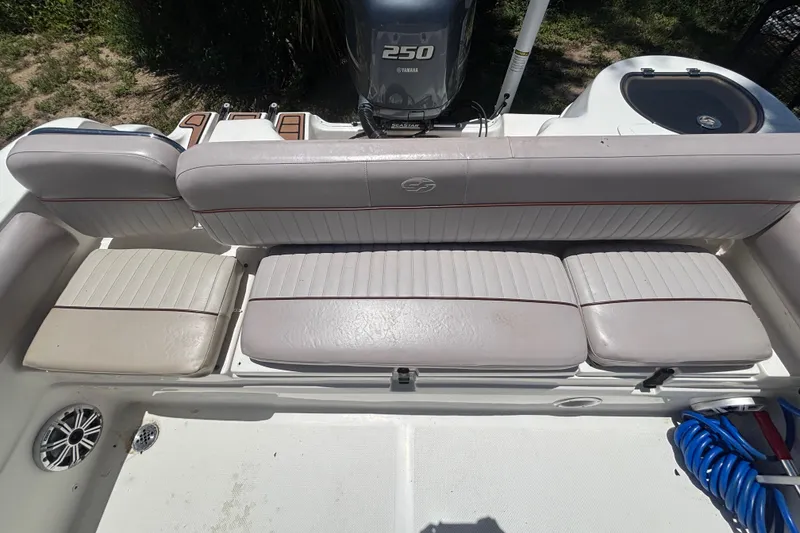 Slide: The Image of 2016 Sea Fox 249 Avenger boat interior with cushioned seating and Yamaha 250 engine. - 75