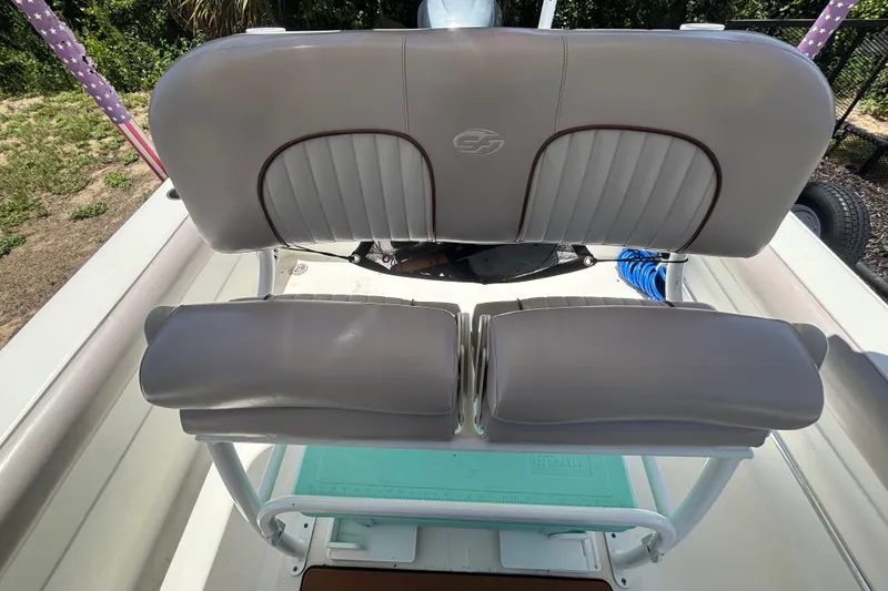 Slide: The Image of 2016 Sea Fox 249 Avenger boat seating with cushioned backrests and storage underneath. - 71
