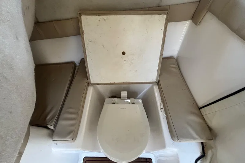 Slide: The Image of Interior view of a 2016 Sea Fox 249 Avenger boat's compact toilet area. - 44