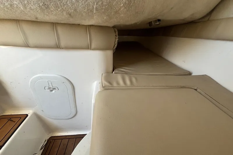 Slide: The Image of Interior cabin view of a 2016 Sea Fox 249 Avenger boat with beige seating. - 45