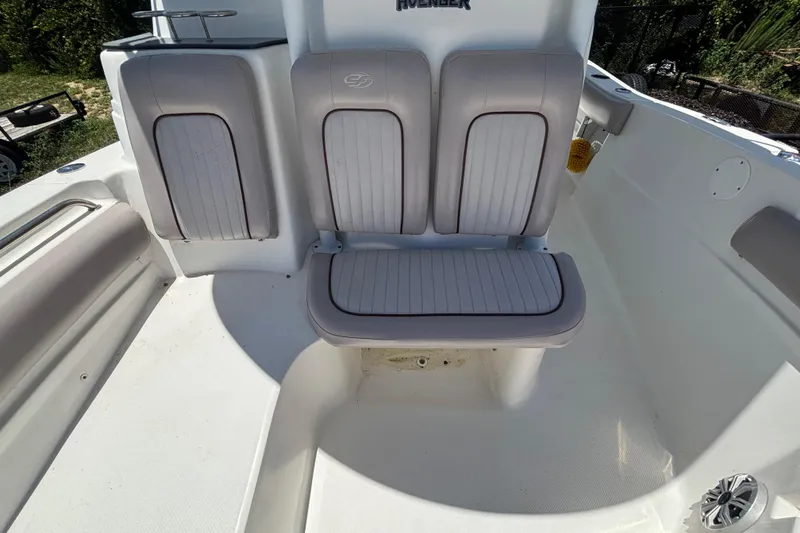 Slide: The Image of 2016 Sea Fox 249 Avenger boat seating area with cushioned seats and white interior. - 67