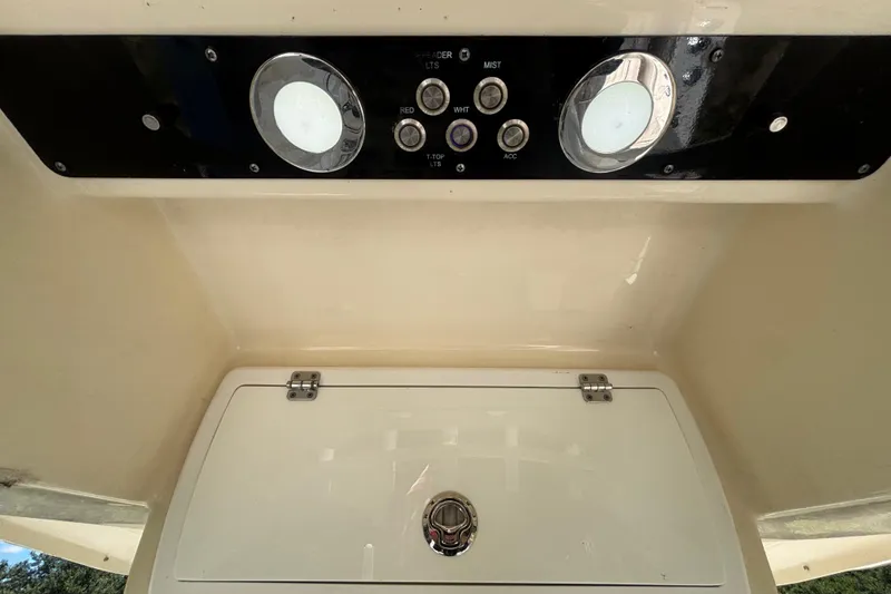 Slide: The Image of Control panel of a 2016 Sea Fox 249 Avenger boat with switches and lights. - 31