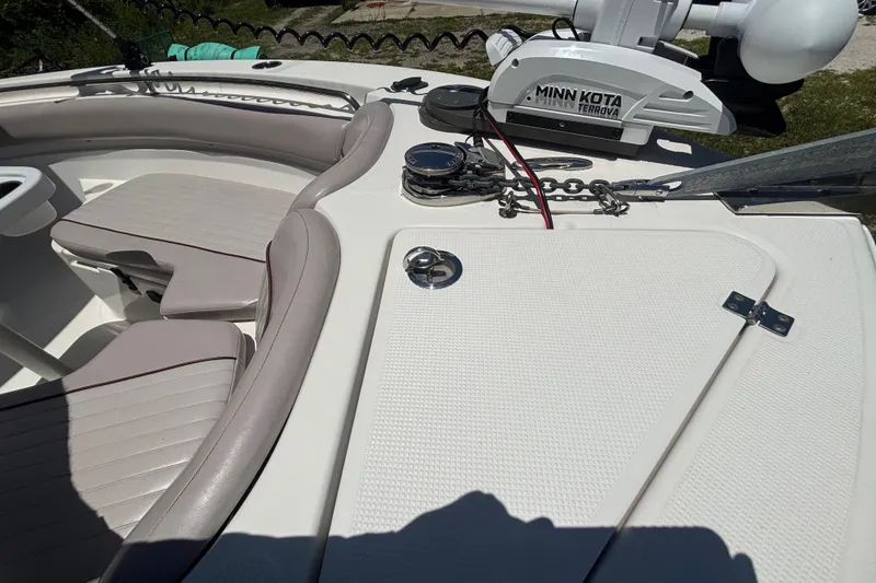 Slide: The Image of 2016 Sea Fox 249 Avenger boat deck with Minn Kota Terrova motor and seating area. - 54