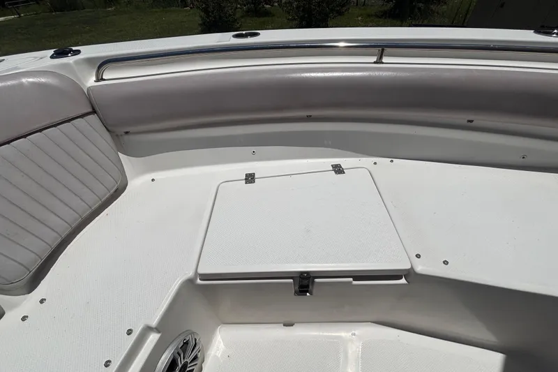 Slide: The Image of 2016 Sea Fox 249 Avenger boat interior with cushioned seating and storage compartment. - 63