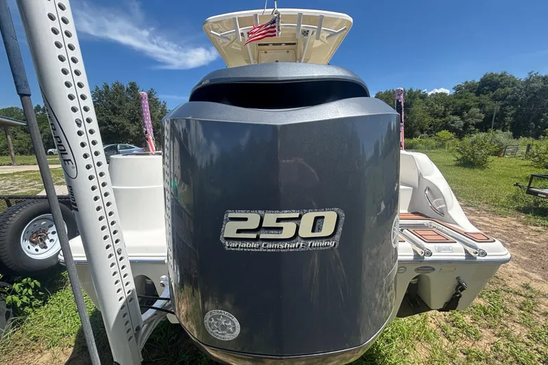 Slide: The Image of 2016 Sea Fox 249 Avenger boat with 250 horsepower engine, parked outdoors. - 5