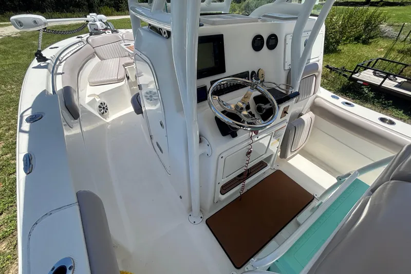 Slide: The Image of 2016 Sea Fox 249 Avenger boat interior with steering console and seating. - 39
