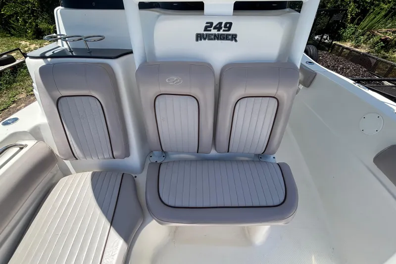 Slide: The Image of 2016 Sea Fox 249 Avenger boat seating area with cushioned seats and backrest. - 58