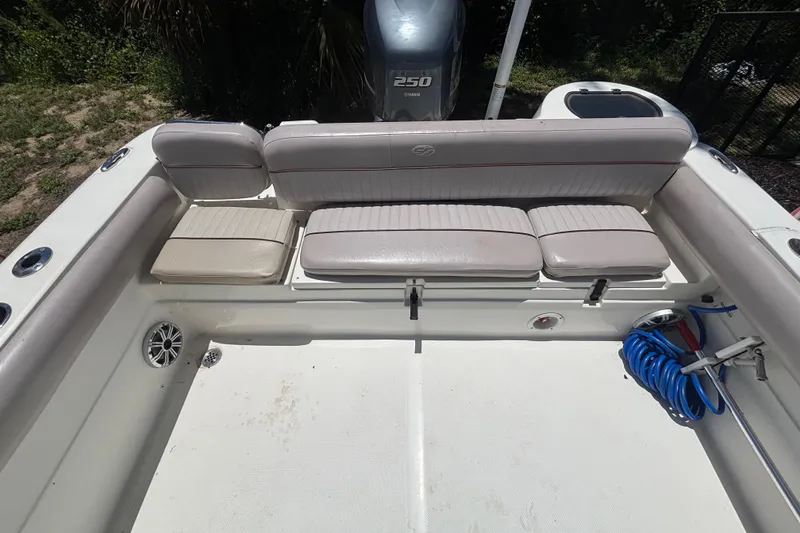 Slide: The Image of 2016 Sea Fox 249 Avenger boat interior with cushioned seating and Yamaha 250 engine. - 74