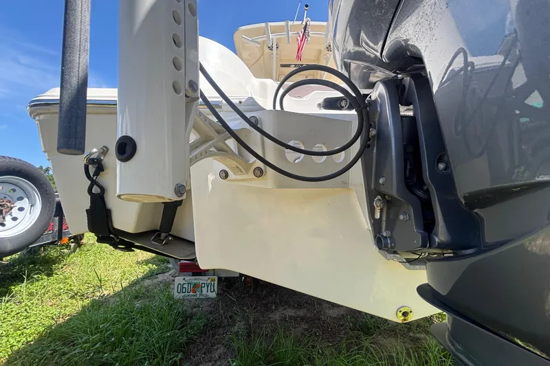 Slide: The Image of 2016 Sea Fox 249 Avenger boat rear view with motor and trailer. - 7