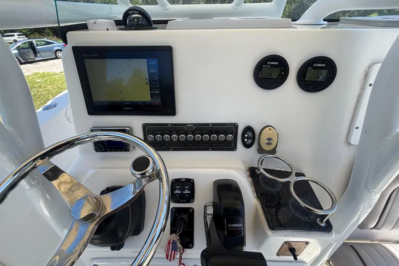 Slide: The Image of 2016 Sea Fox 249 Avenger dashboard with Garmin display and Yamaha controls. - 21