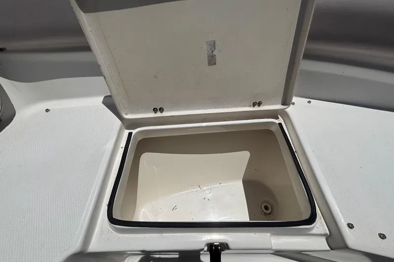 Slide: The Image of Open storage compartment on a 2016 Sea Fox 249 Avenger boat. - 64