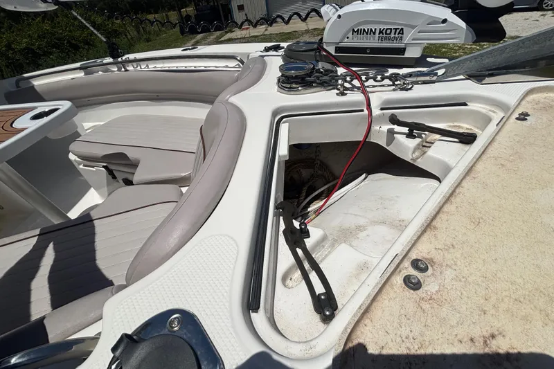 Slide: The Image of 2016 Sea Fox 249 Avenger boat interior with Minn Kota Terrova motor and seating area. - 55