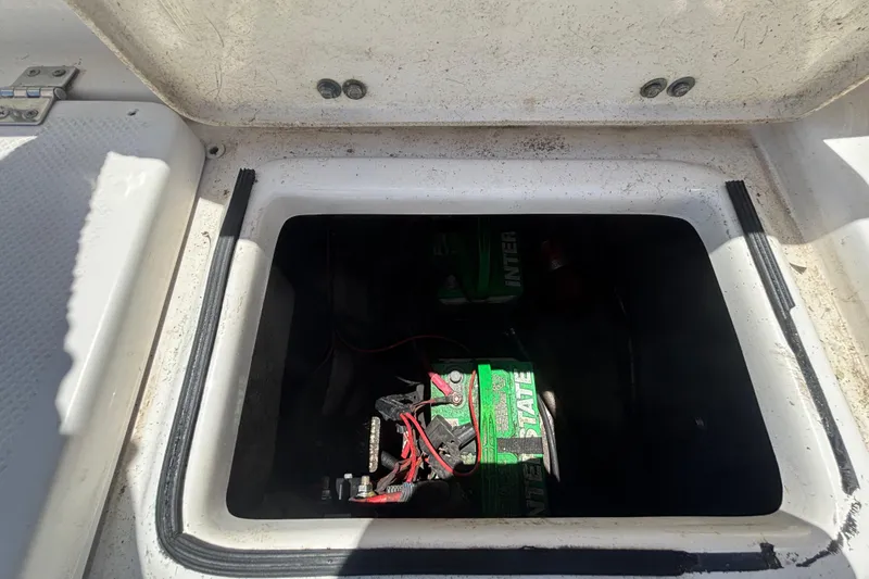 Slide: The Image of Battery compartment of a 2016 Sea Fox 249 Avenger boat, showing Interstate batteries. - 79