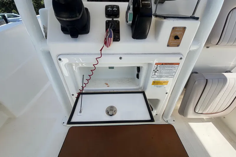 Slide: The Image of 2016 Sea Fox 249 Avenger boat console with storage compartment and control panel. - 28