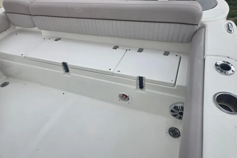Slide: The Image of 2016 Sea Fox 249 Avenger boat interior with seating and storage compartments. - 3