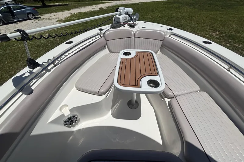 Slide: The Image of 2016 Sea Fox 249 Avenger boat interior with seating and wooden table. - 51