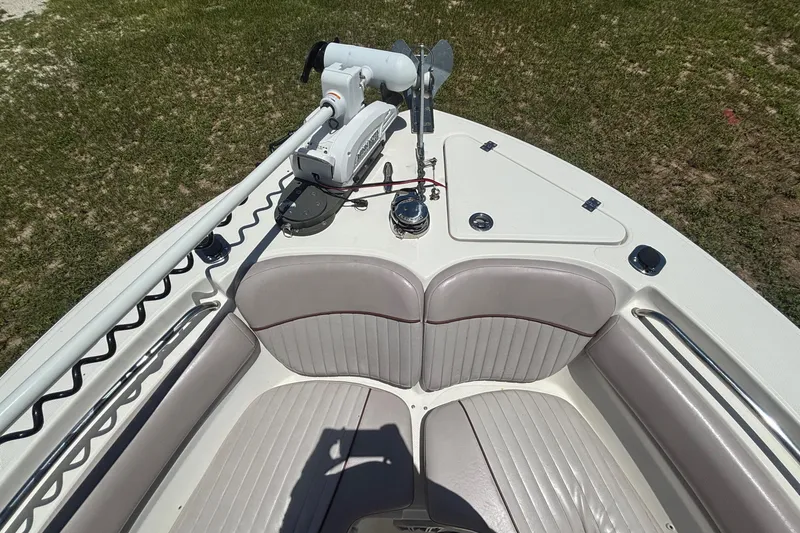 Slide: The Image of Bow seating area of a 2016 Sea Fox 249 Avenger boat with trolling motor. - 53