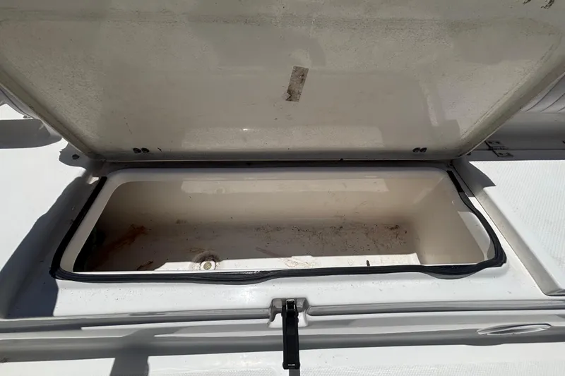 Slide: The Image of Open storage compartment on a 2016 Sea Fox 249 Avenger boat. - 77
