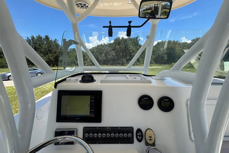 Slide: The Image of 2016 Sea Fox 249 Avenger boat dashboard with navigation and control instruments. - 29