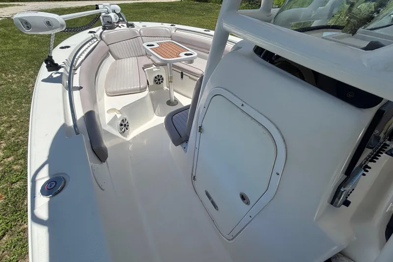 Slide: The Image of 2016 Sea Fox 249 Avenger boat interior with seating and table, showcasing spacious design. - 40