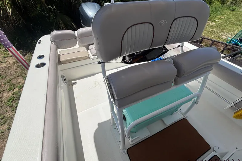 Slide: The Image of 2016 Sea Fox 249 Avenger boat interior with cushioned seating and rod holders. - 73