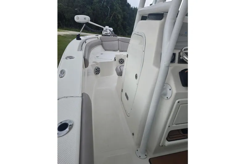 Slide: The Image of The image shows the deck of a 2016 Sea Fox 249 Avenger boat with seating area and helm console. - 6