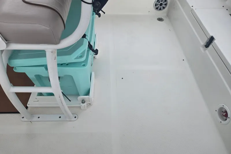 Slide: The Image of Interior of a 2016 Sea Fox 249 Avenger boat, featuring seating and storage. - 4