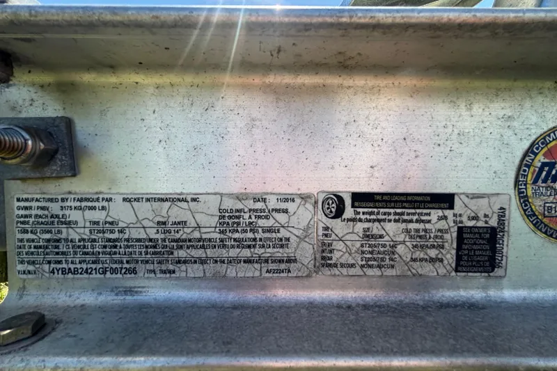 Slide: The Image of Label on a 2016 Sea Fox 249 Avenger, detailing tire and loading information. - 86