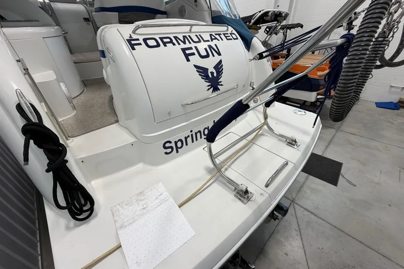 Slide: The Image of 2004 Formula 34 Performance Cruiser boat with "Formulated Fun" branding in a garage setting. - 5