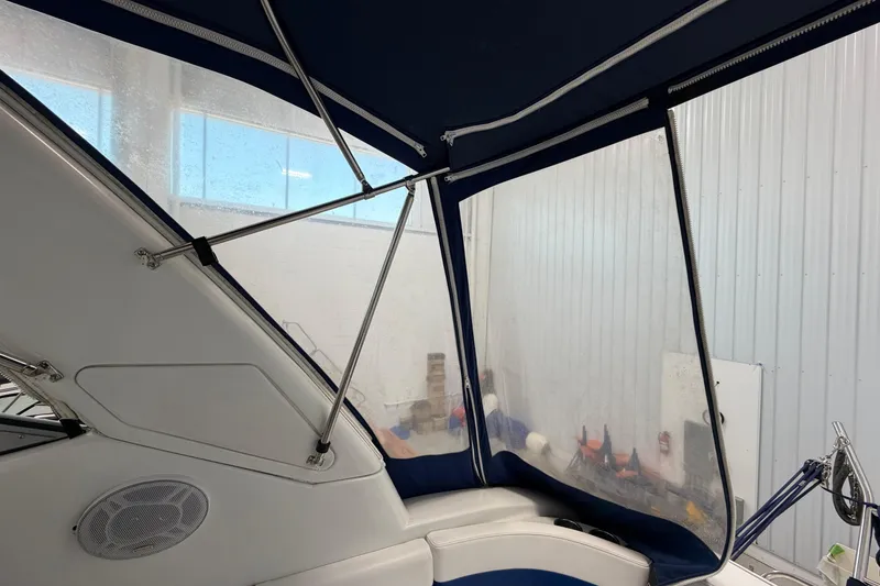 Slide: The Image of Interior view of a 2004 Formula 34 Performance Cruiser with blue canopy and clear panels. - 9
