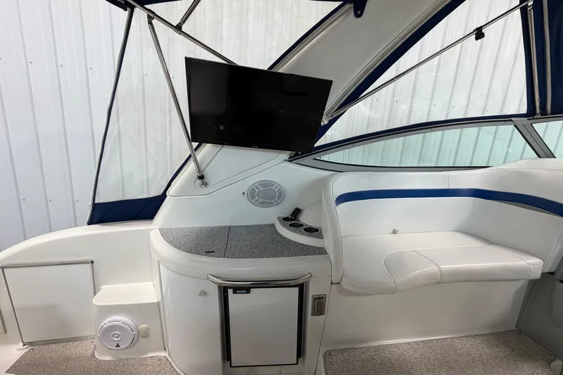 Slide: The Image of 2004 Formula 34 Performance Cruiser interior with seating, TV, and modern amenities. - 10