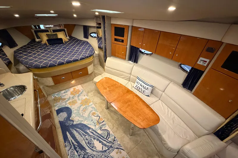 Slide: The Image of Luxurious interior of a 2004 Formula 34 Performance Cruiser with elegant seating and decor. - 19