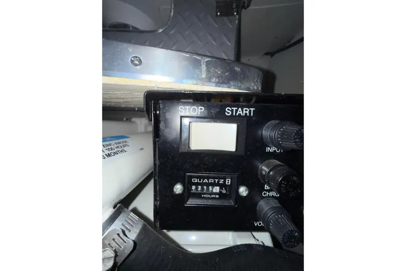 Slide: The Image of Control panel of a 2004 Formula 34 Performance Cruiser with hour meter display. - 41