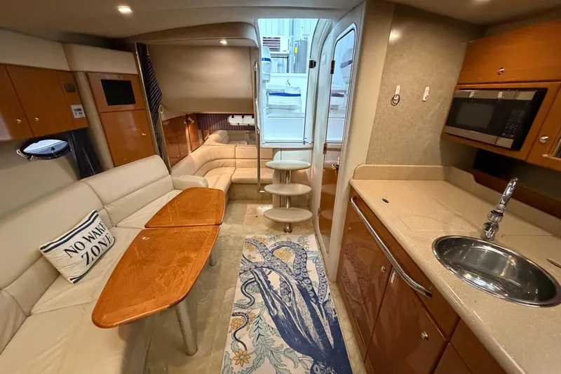 Slide: The Image of Interior of 2004 Formula 34 Performance Cruiser with modern kitchen and cozy seating area. - 30