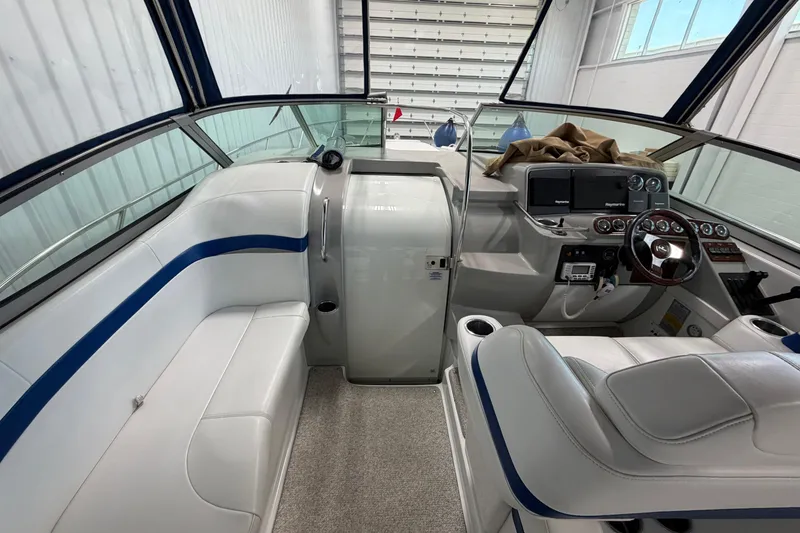 Slide: The Image of 2004 Formula 34 Performance Cruiser interior with white seating and modern dashboard. - 12