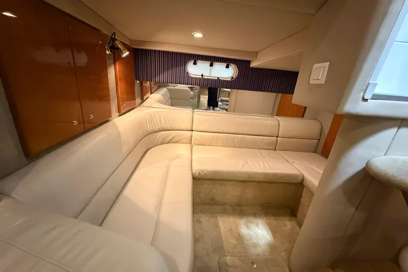Slide: The Image of Luxurious interior of a 2004 Formula 34 Performance Cruiser with beige leather seating. - 22