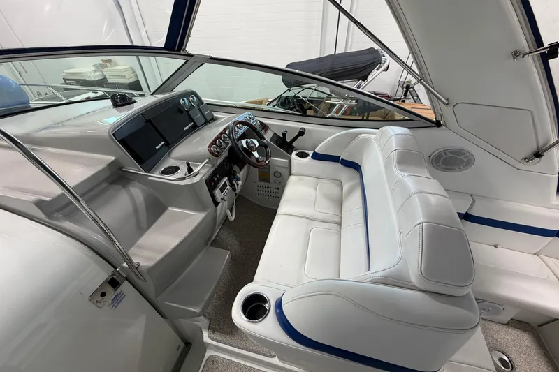 Slide: The Image of 2004 Formula 34 Performance Cruiser interior with white seating and modern dashboard. - 14
