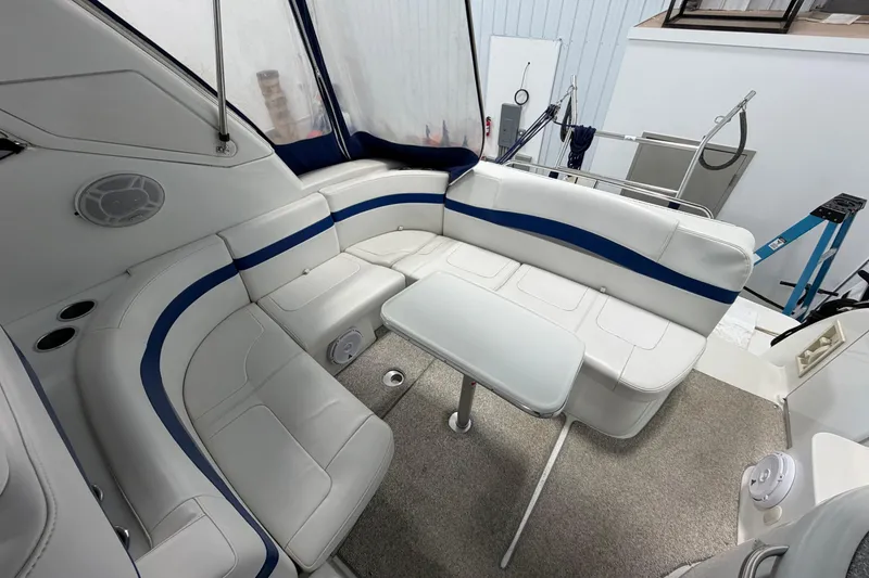 Slide: The Image of 2004 Formula 34 Performance Cruiser interior with white seating and table. - 8