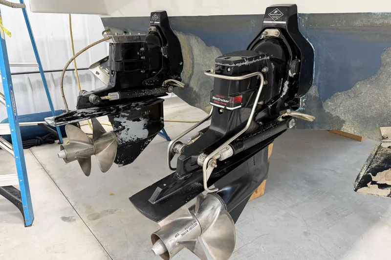 Slide: The Image of 2004 Formula 34 Performance Cruiser with dual MerCruiser outdrives in a workshop setting. - 35