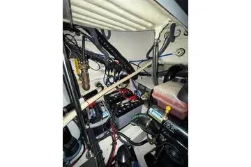 Slide: The Image of Engine compartment of a 2004 Formula 34 Performance Cruiser, showcasing wiring and components. - 38