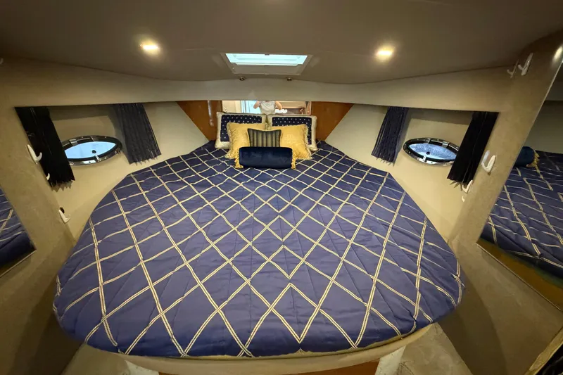 Slide: The Image of Luxurious cabin interior of a 2004 Formula 34 Performance Cruiser with elegant bedding. - 26