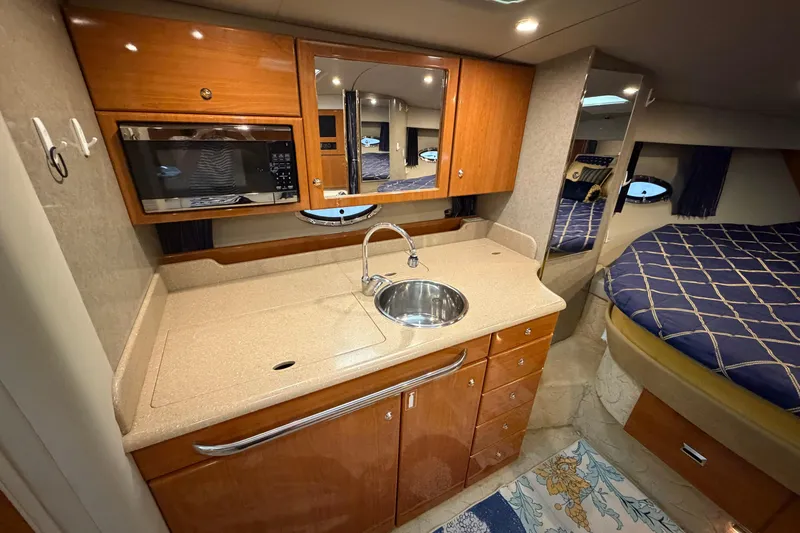 Slide: The Image of 2004 Formula 34 Performance Cruiser interior with kitchenette and cozy sleeping area. - 24