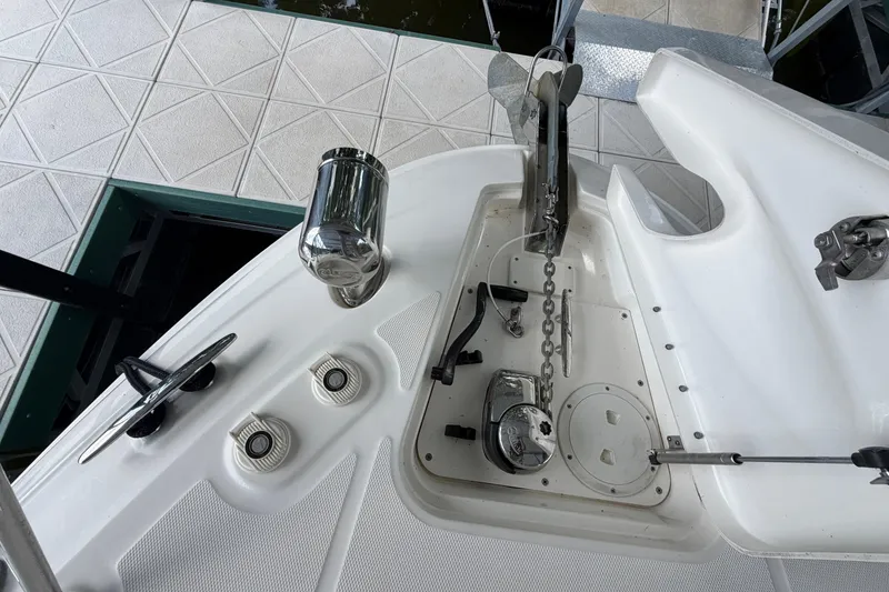 Slide: The Image of 2012 Sea Ray Sundancer 310 boat deck with anchor and winch system. - 22