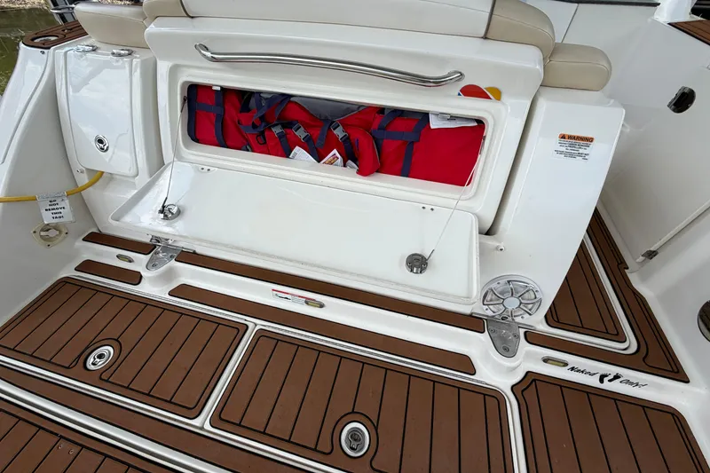 Slide: The Image of 2012 Sea Ray Sundancer 310 swim platform with storage compartment and teak-style flooring. - 7