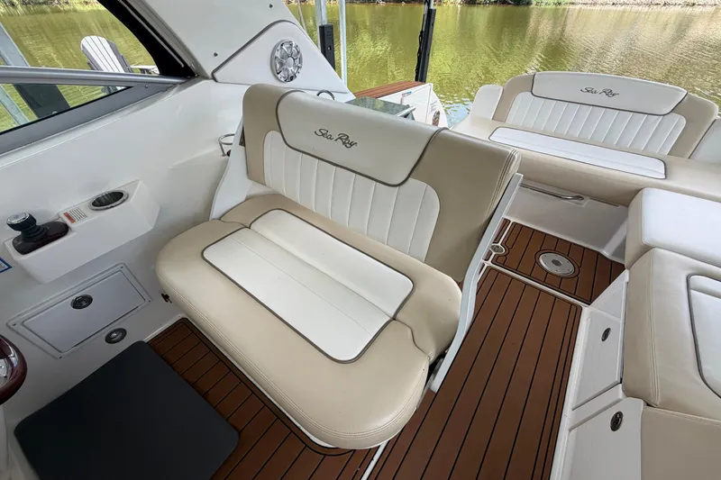 Slide: The Image of Interior of 2012 Sea Ray Sundancer 310 with beige seating and wood flooring. - 12