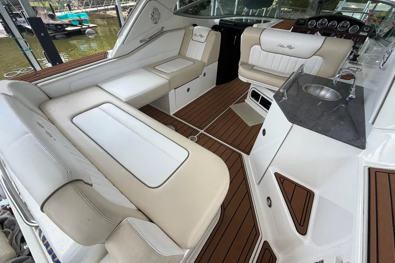 Slide: The Image of Luxurious interior of 2012 Sea Ray Sundancer 310 with plush seating and sleek design. - 8