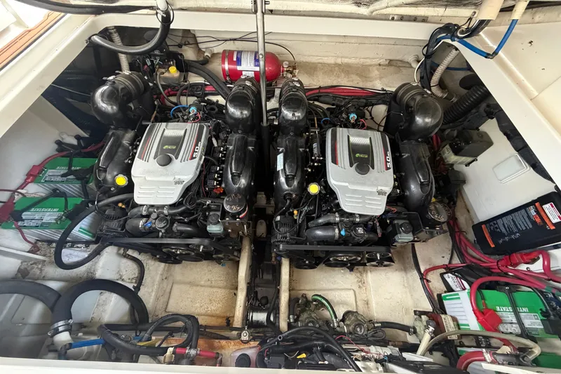Slide: The Image of Engine compartment of a 2012 Sea Ray Sundancer 310 with twin engines and batteries. - 31