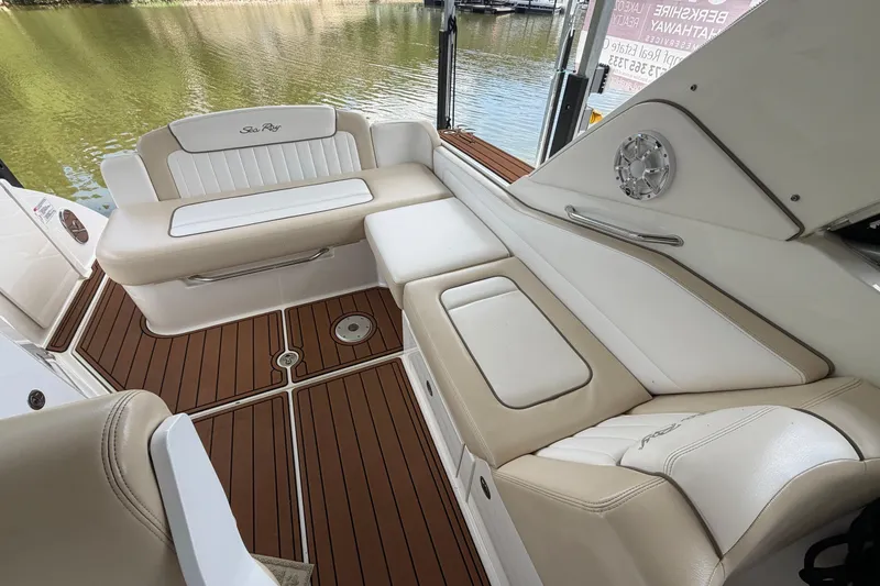 Slide: The Image of Luxurious interior of 2012 Sea Ray Sundancer 310 with plush seating and elegant wood flooring. - 9