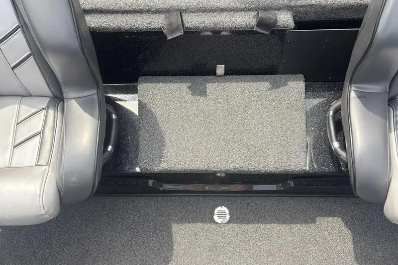 Slide: The Image of Interior seating of a 2018 Nitro Z19 Pro boat, featuring gray upholstery and carpeted flooring. - 27