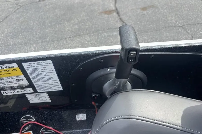 Slide: The Image of Throttle control lever on a 2018 Nitro Z19 Pro boat dashboard. - 25